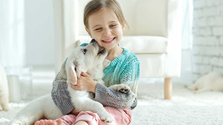 happy healthy puppy and girl